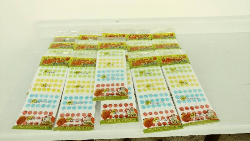 lot 84 image: 16 packages of Sour Candy Buttons
