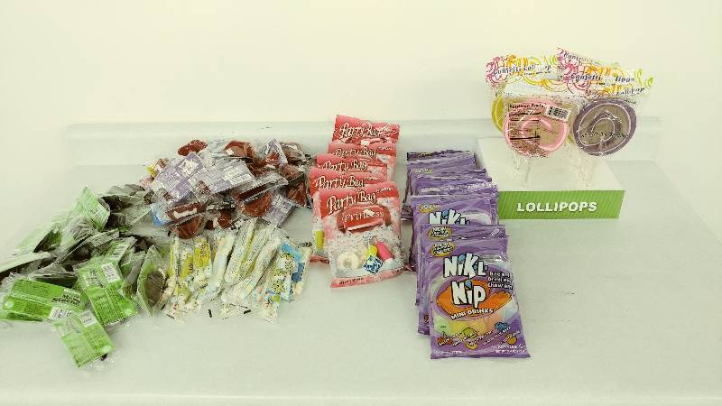 lot 92 image: Lot of Candy Necklaces, Lollipops, and other Candies