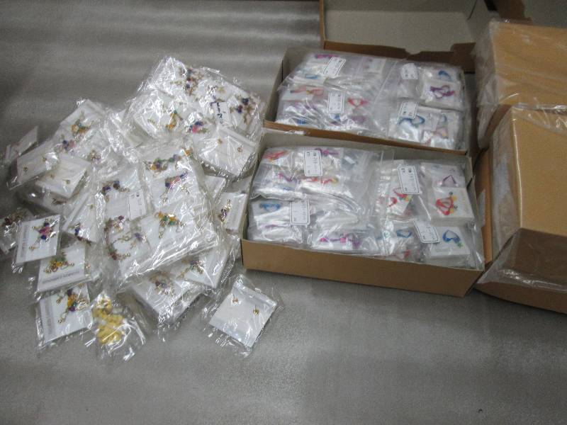 lot 99 image: 6 Boxes of 8 dozen earrings plus ex...