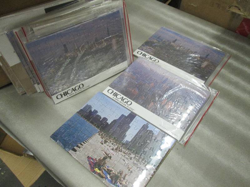 lot 214 image: Case of Mini Chicago Puzzles...