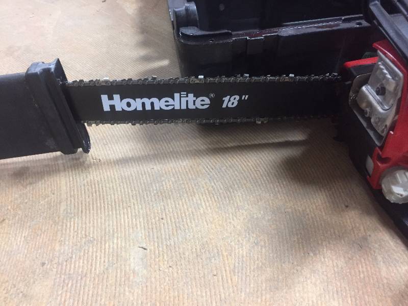 lot 90 image: Homelite 18 in. 42cc Gas Chainsaw in like New working conditions