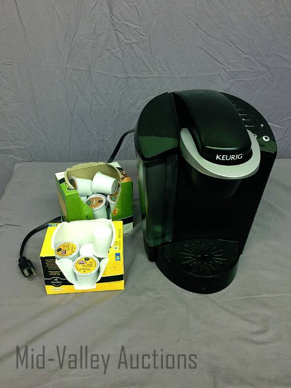 lot 23 image: Keurig machine with coffee packs