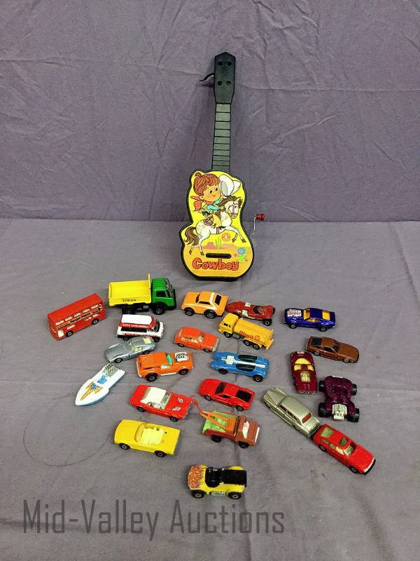 lot 218 image: Toy cars and Guitar