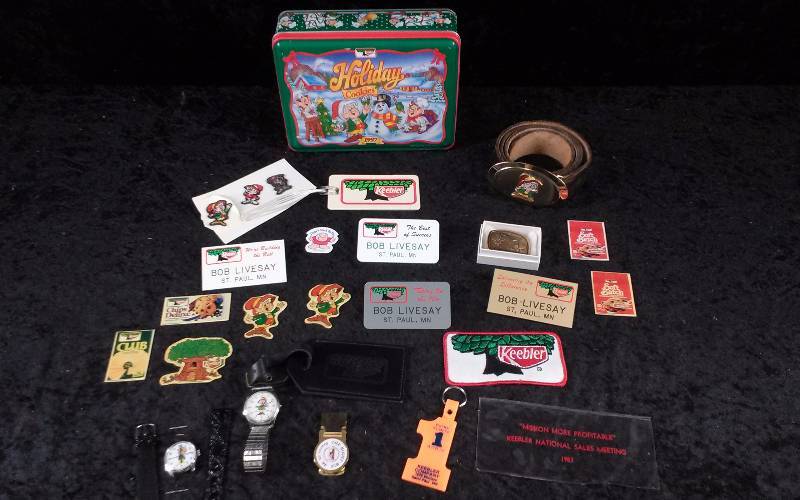 lot 56 image: Lot - Vintage KEEBLER Collectibles - Belt Buckles, Watches, Misc