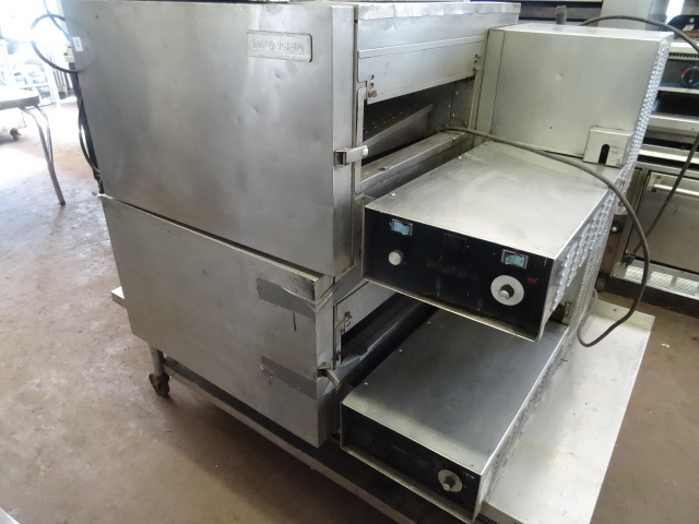 lot 70 image: Impinger Double Conveyor Pizza Oven. Natural Gas. Model 1116. Comes with 4 Wheels Stainless Stand. Only One Conveyor Included