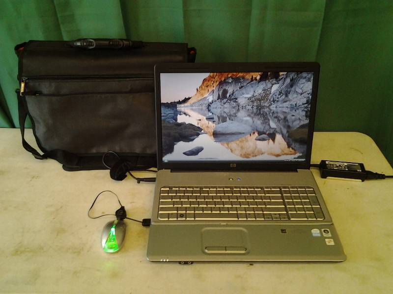 lot 1 image: HP G-70 17 Inch Wide Screen Lap Top With Charger & Case (Powers Up)
