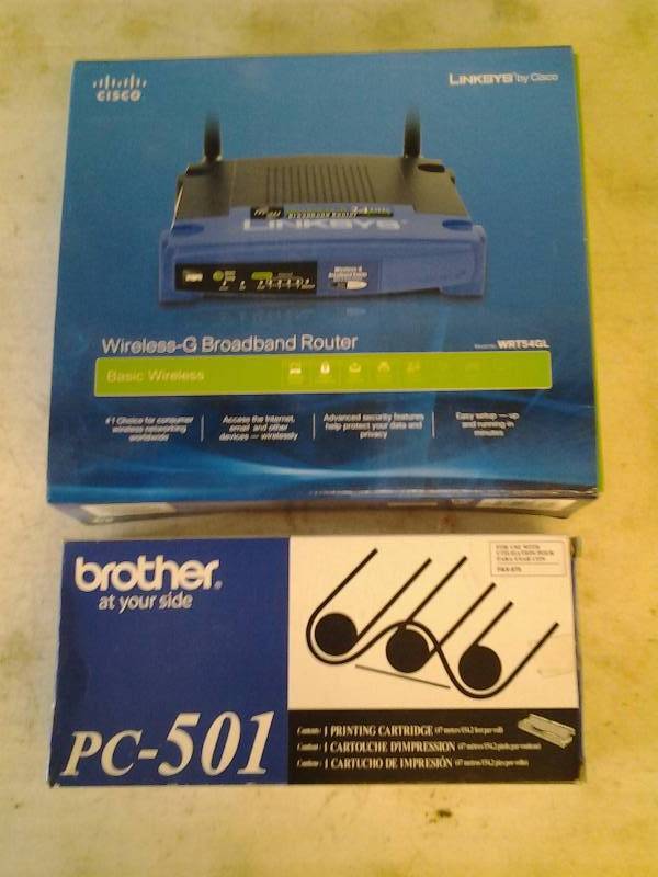 lot 2 image: Link-Sys Wireless Broadband Router, Printer Cartridge