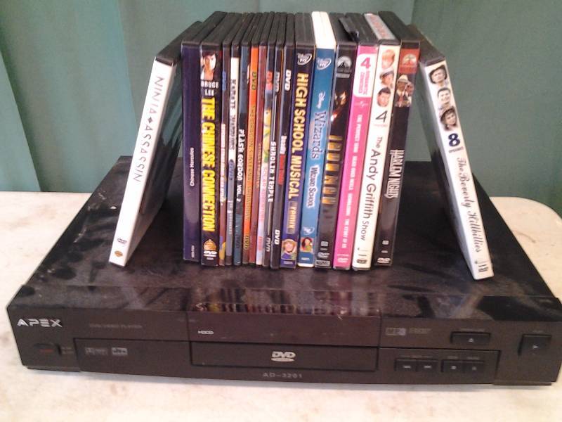 lot 6 image: Apex DVD Player (Powers Up) With 18-DVDs