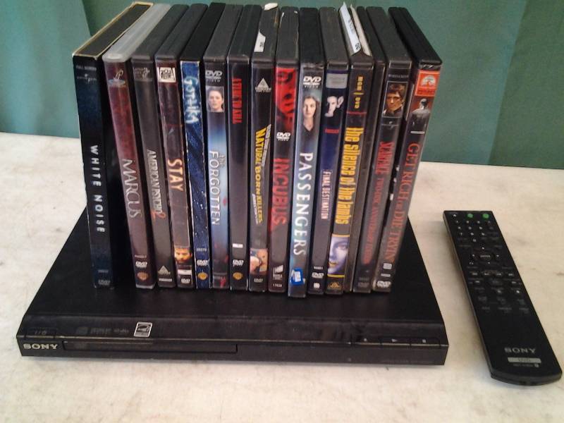 lot 7 image: Sony DVD Player (Powers Up) With 17-DVDs