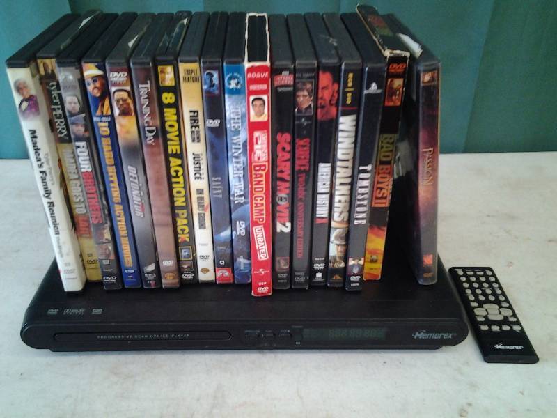 lot 8 image: Memorex DVD Player (Powers Up) With Remote & 18-DVDs