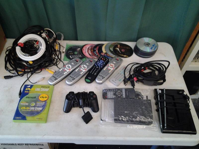 lot 9 image: Lot Of DVDs, Remotes, Digital Converter Box, Antenna, TV Cables (RCA, HDMI, CoAx)