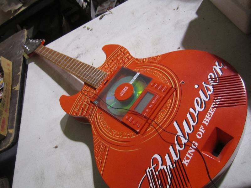 lot 74 image: Budweiser guitar with CD player ...