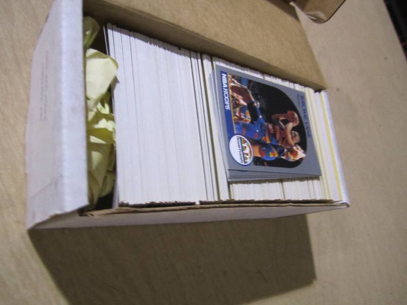 lot 122 image: 1990 NBA Hoops, appears to be a com...