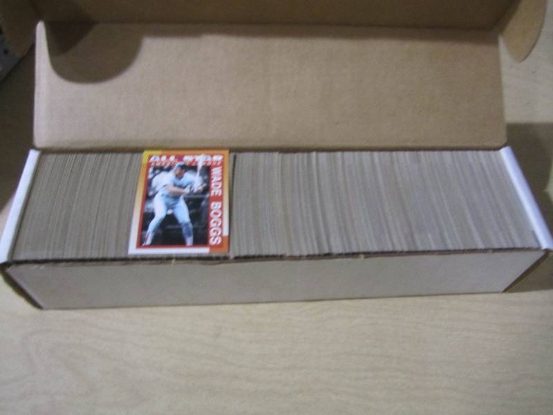 lot 141 image: 1990 Topps baseball cards, appears ...