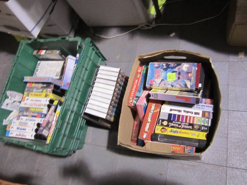lot 184 image: 2 Boxes of movies and books on tape...