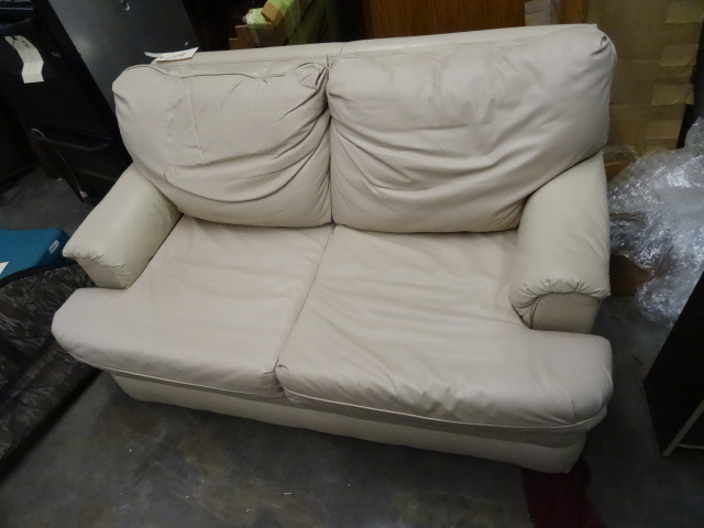 lot 209 image: Loveseat, cream colored, shows wear...