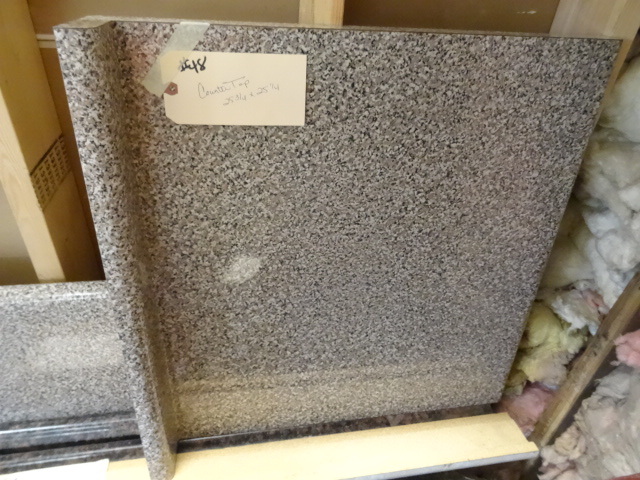 lot 48 image: Countertop, finished edges with bac...