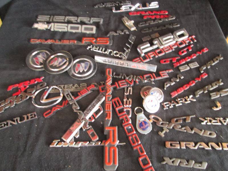 lot 148 image: Assorted Car Name Badges