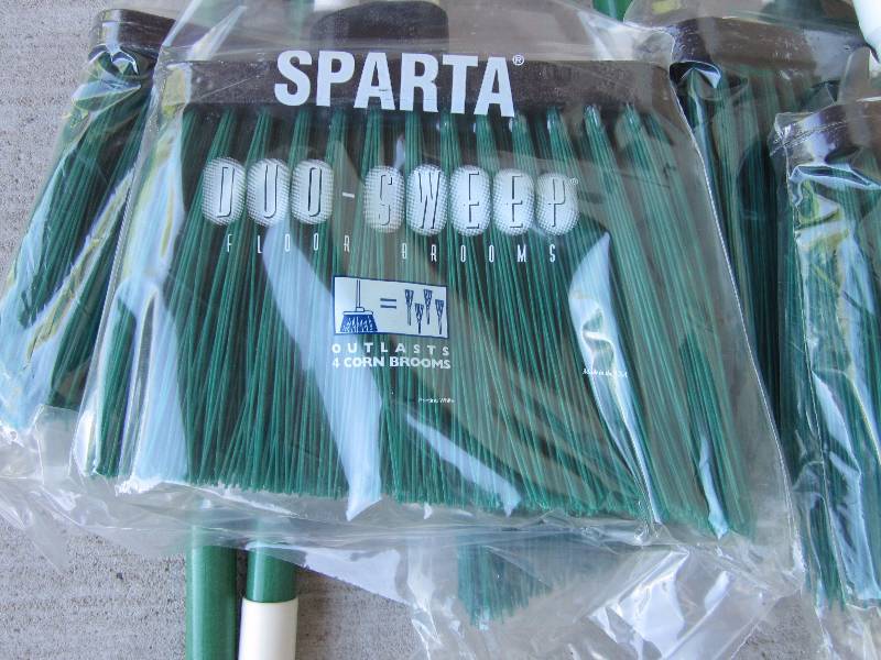 lot 38 image: 9 New Brooms & 2 Dish Washer Racks