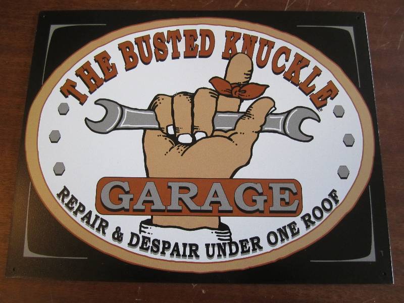lot 18 image: Metal garage sign...