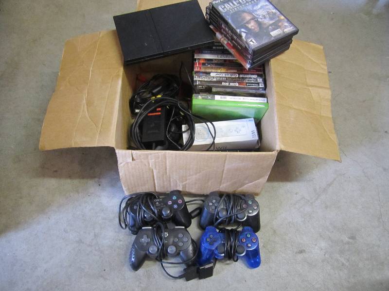 lot 84 image: PS2 with 18 misc games controlers c...
