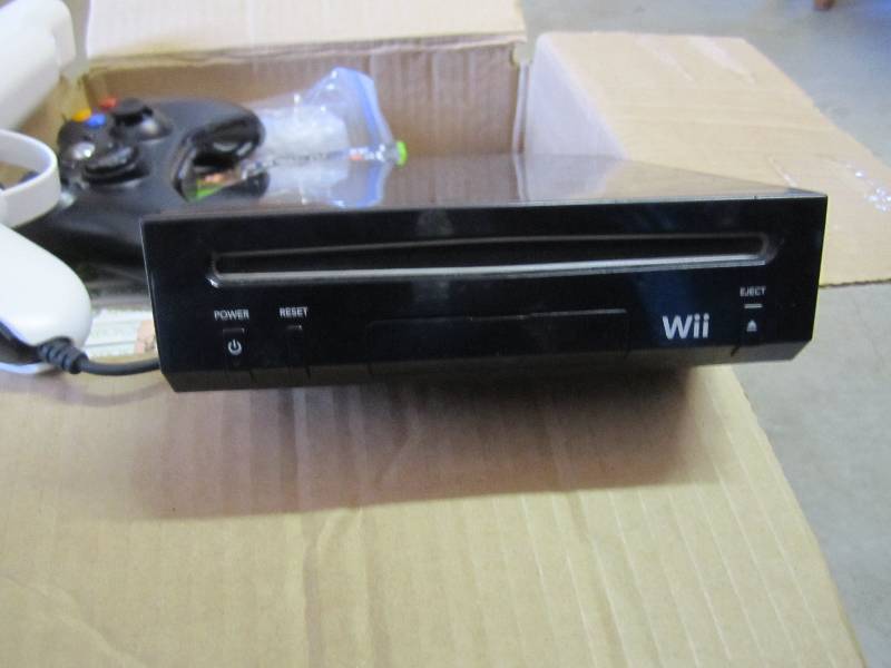 lot 85 image: Wii with multiple misc games contro...
