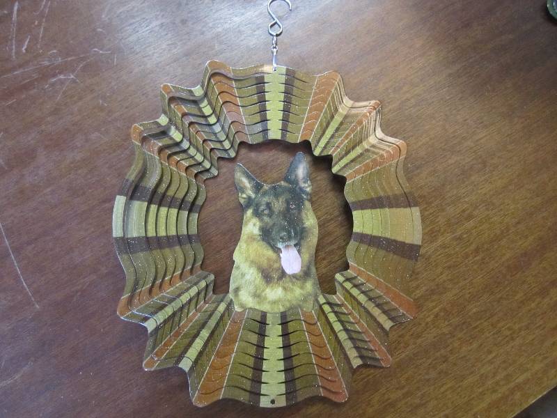 lot 93 image: German Shepard metal wind spinner 1...