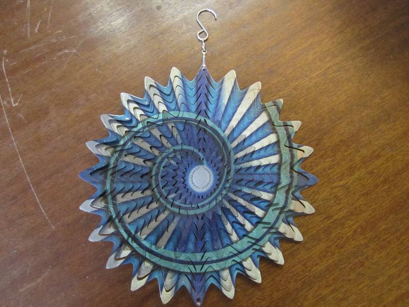 lot 94 image: Blue spiral metal wind spinner 10...