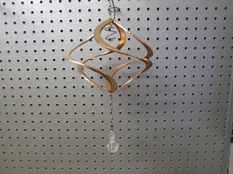 lot 126 image: Copper toned metal wind spinner. 12...