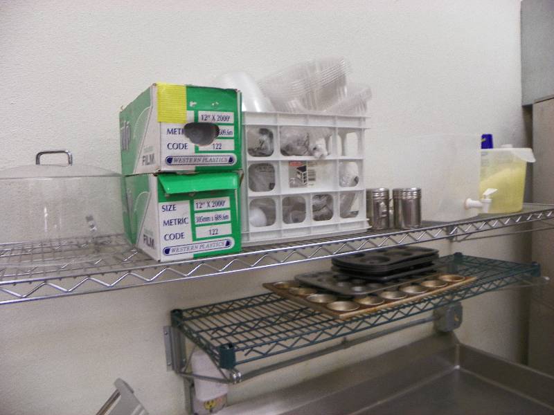lot 6 image: CONTENTS OF SHELVES, FILM WRAP, MUFFIN PANS AND MORE