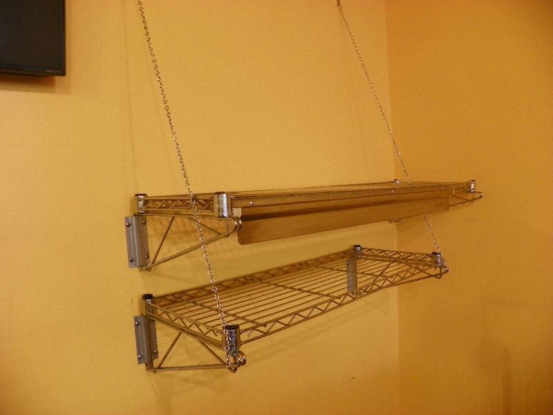 lot 39 image: TWO WALL HUNG SHELVES
