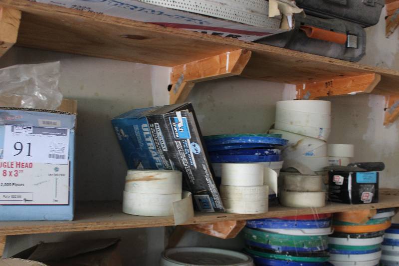 lot 91 image: Shelf Lot Includes Drywall Tape, Grabber Construction Screws, Bugle Head Pro Twist