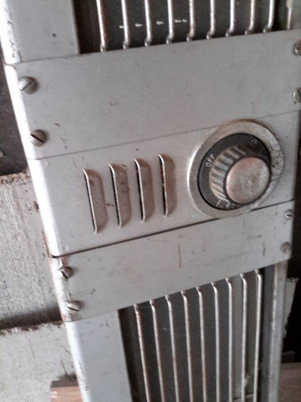 lot 47 image: Hanging Electric heater.. This worked when it was taken down.