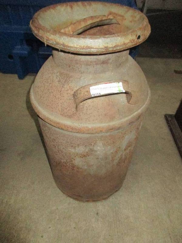 lot 38 image: vintage metal milk jug