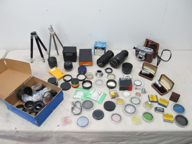 lot 31 image: Large Lot of Vintage Camera Lenses Accessories etc.