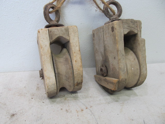 lot 135 image: Pair of Antique Wood Farm Pulleys