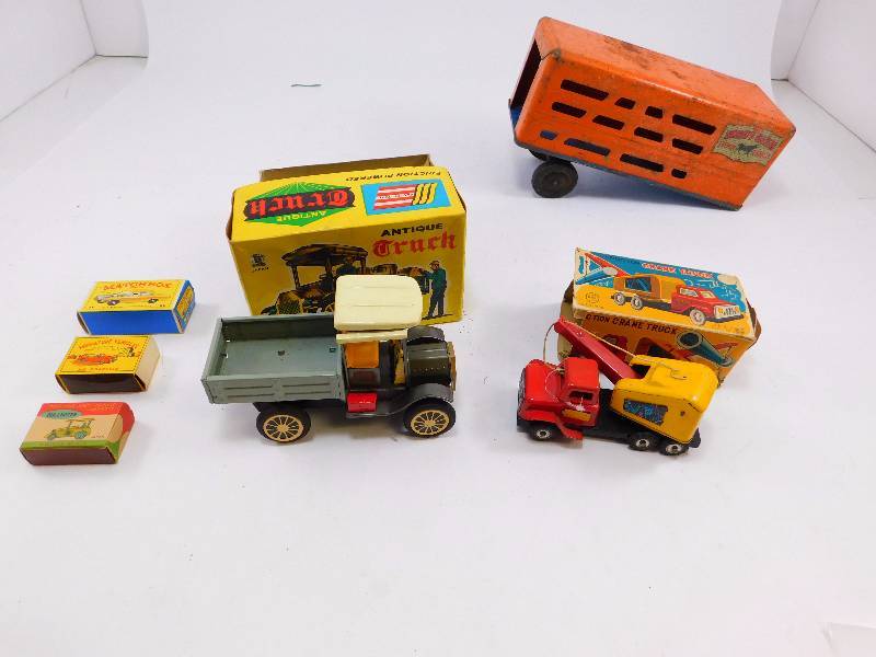lot 64 image: Lot of Vintage Toy Trucks and Boxes