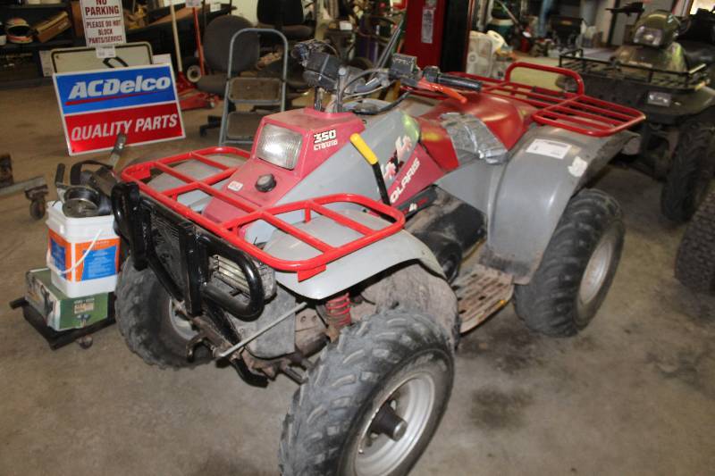 lot 4 image: 1998 Polaris 4-Wheel Liquid Cooled 4x4 ATV w Utility Rack