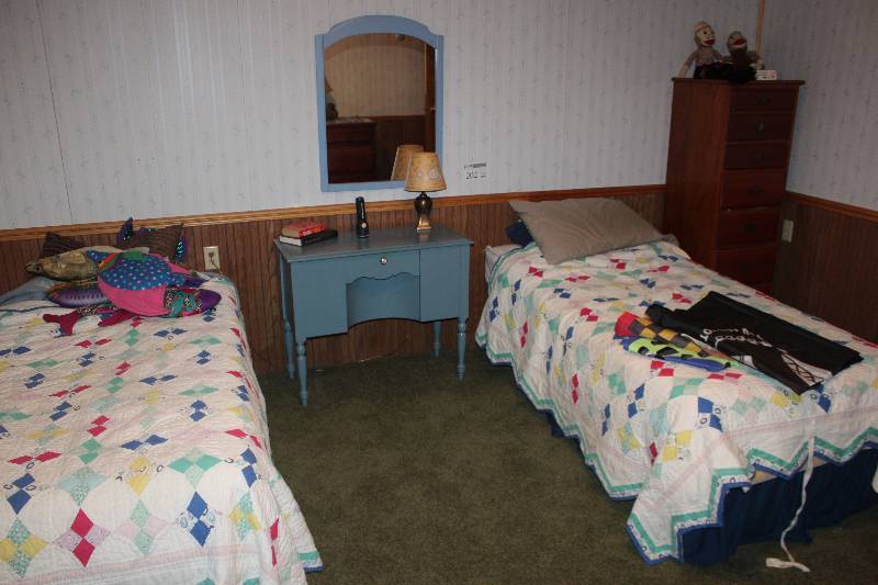 lot 202 image: 2-Twin Beds, Desk, Mirror, Pillows, Sheets, Books, Table Lamp, Desk Contents