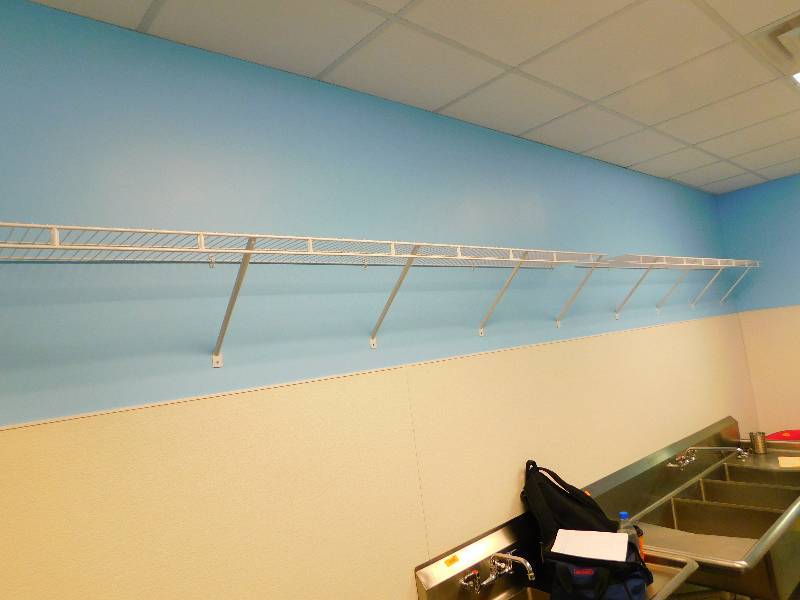 lot 209 image: TWO WALL HUNG WIRE SHELVES