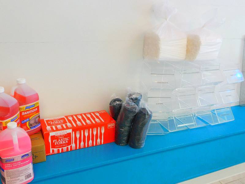 lot 231 image: SOAP, SANITIZER, DETERGENT,  PLASTIC FORKS, TOPPINGS DISPENSER UNIT