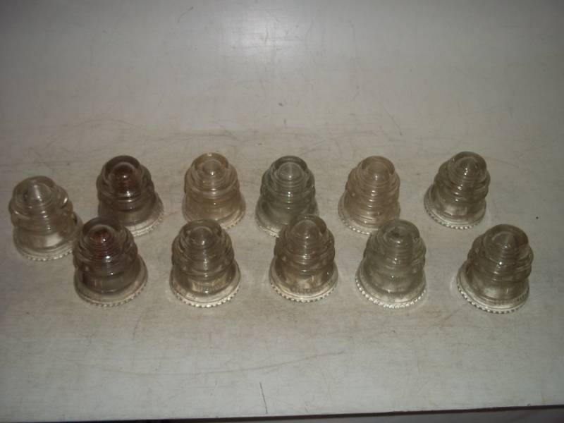 lot 7 image: Hemingray Insulators-- All are # 42. 1 also has # 36 - 52 on it.