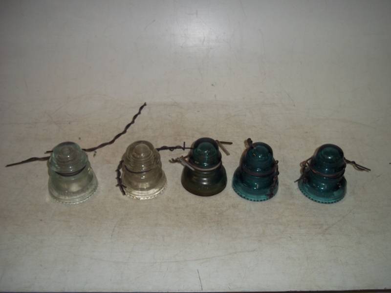 lot 14 image: Hemingray insulator - all are # 42  2 Green also has No.40 & 1 Smaller Green also has No. 40.  All have wire on them yet.