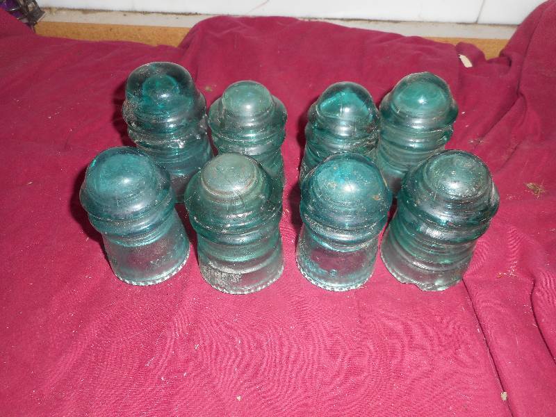 8 VINTAGE GREEN GLASS INSULATERS
