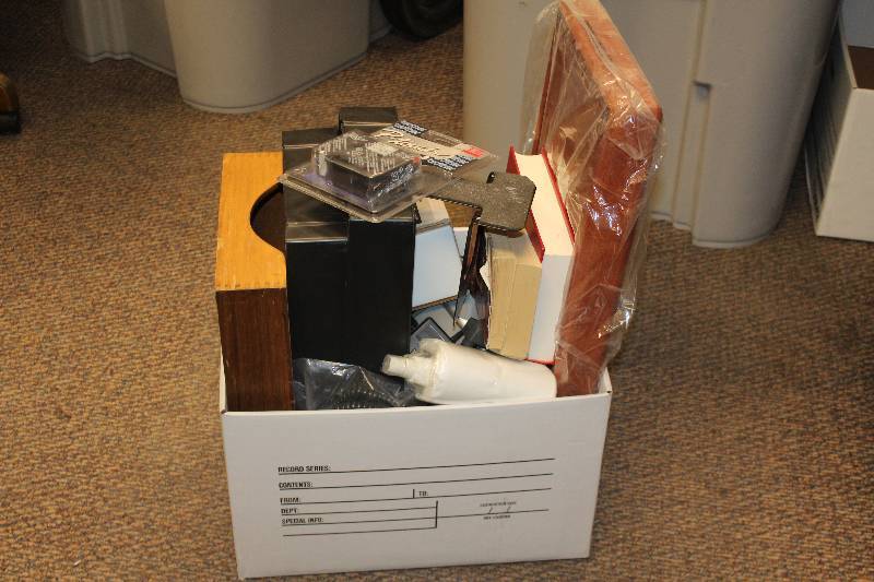 Box Lot of Office Supplies including filing organizers, Labeling system, portable CD player, and Cleaning Kit