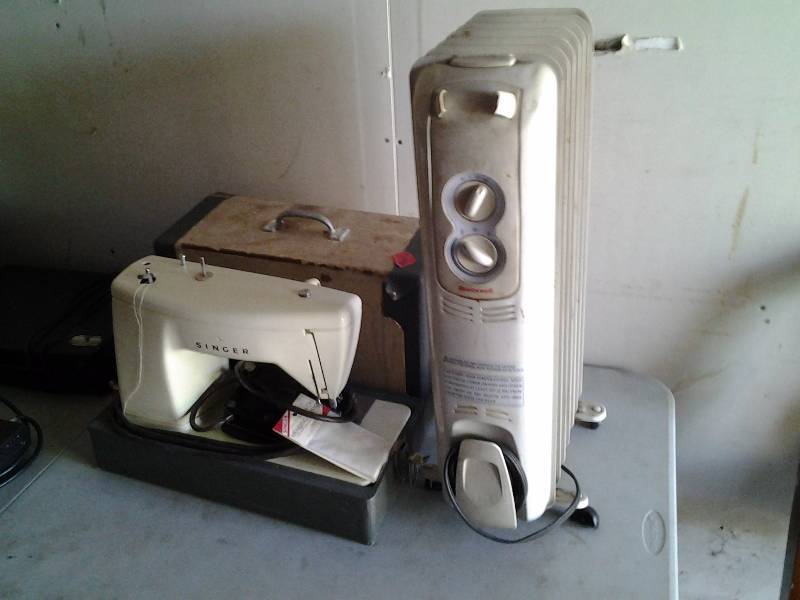 lot 14 image: Portable Singer Sewing Machine With Case, Honeywell Oil Heater