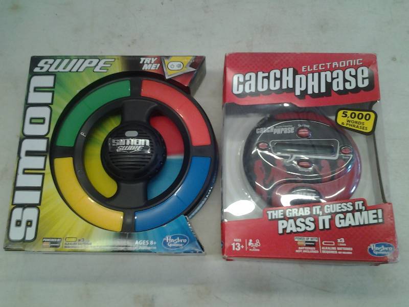 lot 33 image: Electric Catch Phrase, Simon Swipe Electronic Game (Both New In Boxes)