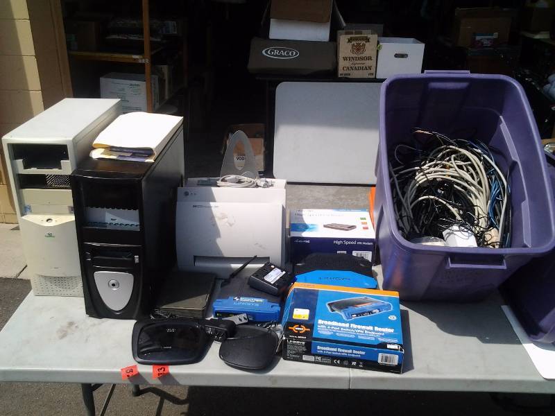lot 82 image: HP Laser Jet, Tote Full Of Wireless Routers, 2-Computer Towers
