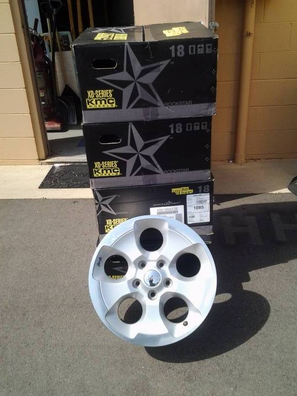 lot 94 image: 4 Stock Factory 18x9 Wheels For Newer Jeep In Boxes