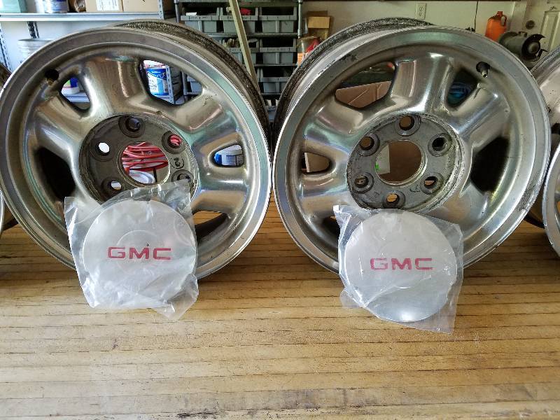 lot 34 image: 16 GMC Rims With Center Caps